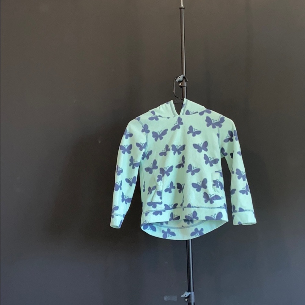 A green and blue sweater